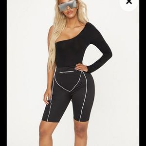 Black cycling shorts with pocket detail.